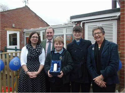 Receiving a thank you gift, L-R Miss Alison Chant, Mr Simon Hoare MP, the Revd Lydia Cook and Mrs Sue Le Riche