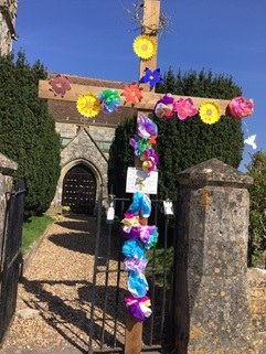 An empty tomb and a garden of Hope at Great Wishford- flowered Easter cross