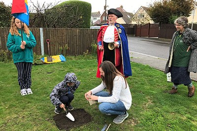 It's a God issue- Finley plants a crab apple tree with the Town Crier