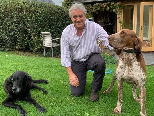 Zooming in on pets- Bear and Pongo with their human