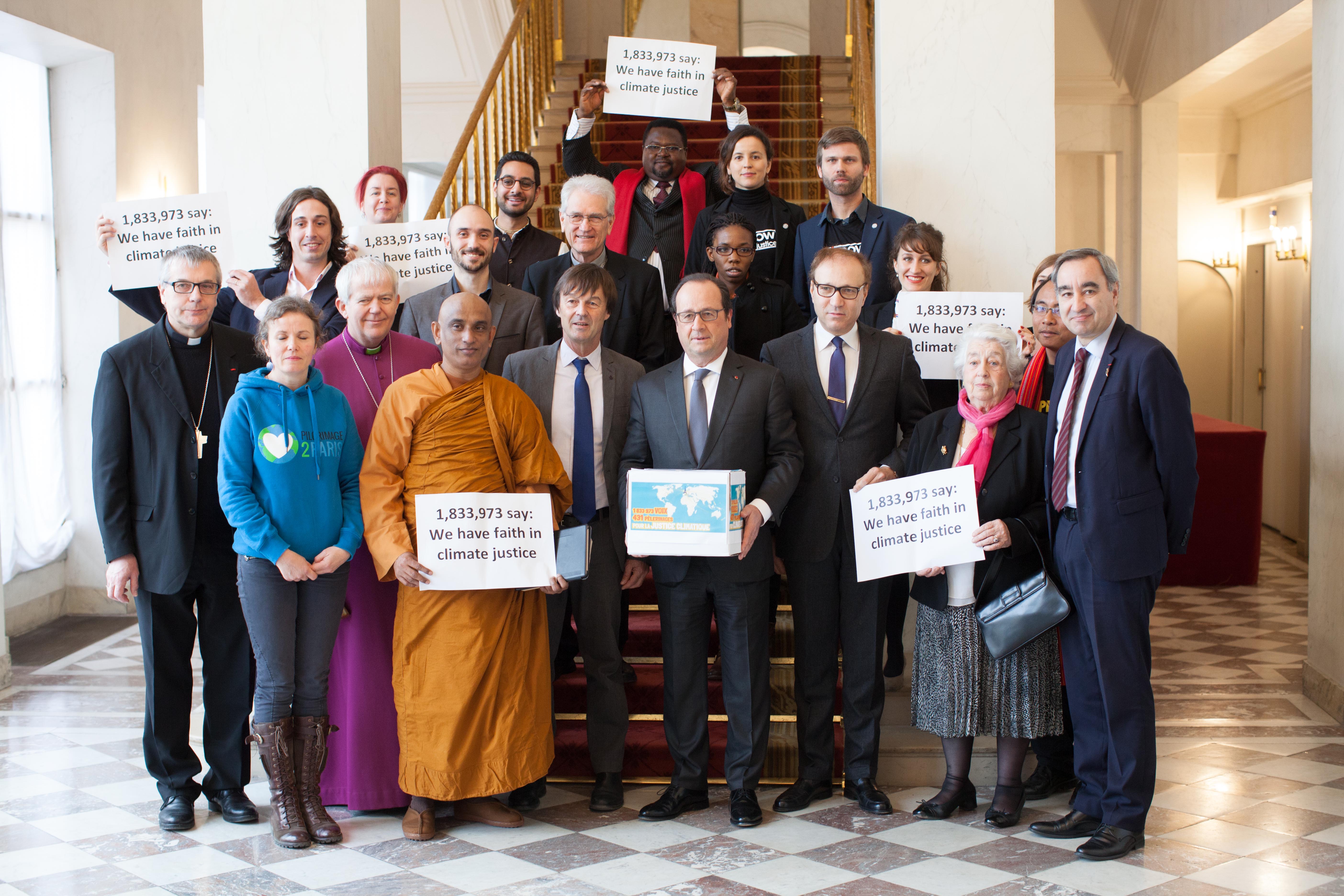 Faith leaders and campaigners delivered a climate justice petition to Francois Hollande at the Presidential palace in Paris today - credit Sean Hawkey.jpg